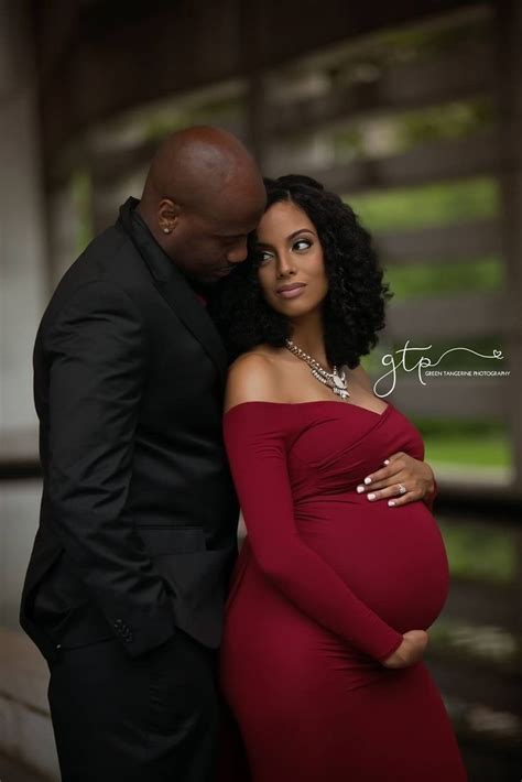 picture of pregnant woman with husband|black couple pregnancy photoshoot.